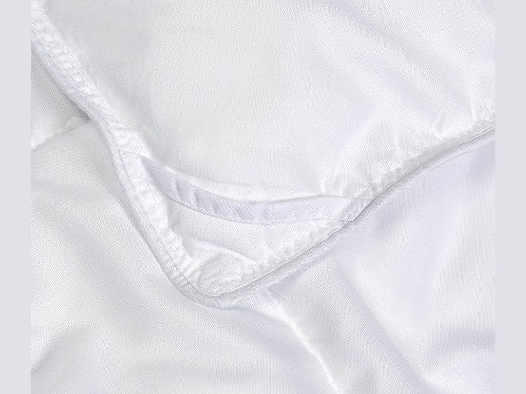 SNAP-EZ Quilt lightweight duvet insert with snap-on loops for secure bedding attachment