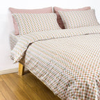 Colorful sage checker bedding set with snaps on bed